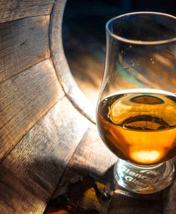 Whisky glass inside barrel
